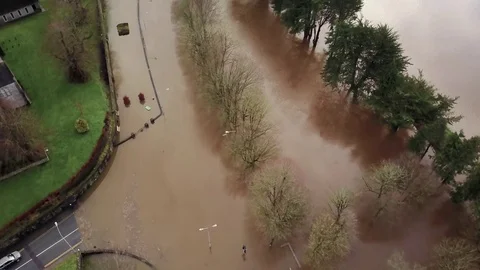 Topdown Aerial view of flooded road adjacent to a supermarket Stock Footage 85227968