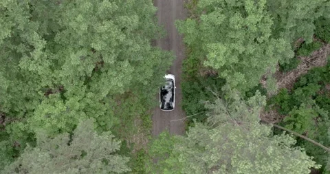 Topdown of an electric car in the forest Stock Footage 164958986