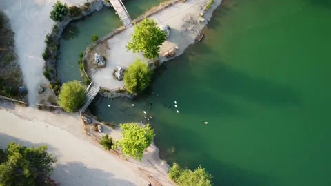 Topdown shot of emerald green lake Beletsi Kirki Stockbeeldmateriaal 248450894