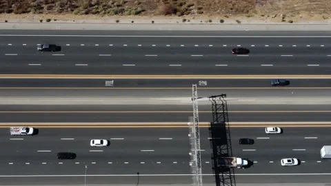 Topdown side panning shot of Highway 14 near Sierra Hwy offramp Stock Footage 218578149