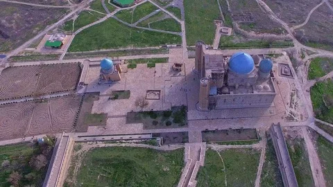 Topdown tracking backward shot of the Mausoleum of Khoja Ahmed Yasawi in Stock Footage 99086183