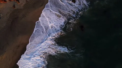 Topdown View of Ocean Waves Crashing into Shore in Malibu Beach Video stock 230926535