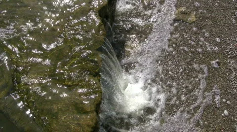 Topdown view of small waterfall splashing into pond (High Definition) Stock Footage 365168