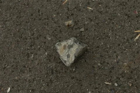 Topdown view of triangular stone with surface details and color subtlety Stock Photos
