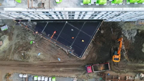 Topdown view of unfinished residential complex. Construction workers in hardhats Video stock 163256332