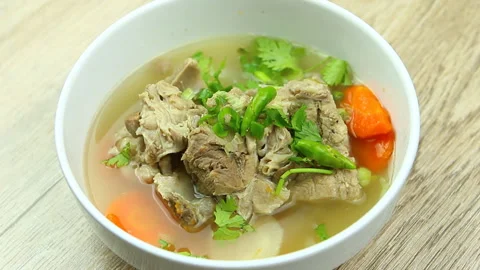 Toping pork bone  soup with chili and vegetable , Thai or Chinese food Stock-Footage 142301351