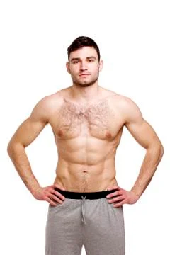 Topless man stood isolated on a white background Stock Photos