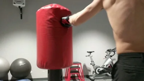 Topless Model on Punch Bag Slow Motion Stock Footage 78614810