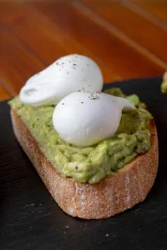 Topped Bread with different toppings avocado eggs Stock Photos