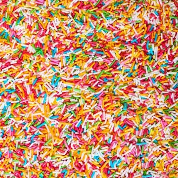 Topping the cake or candy. Stock Photos