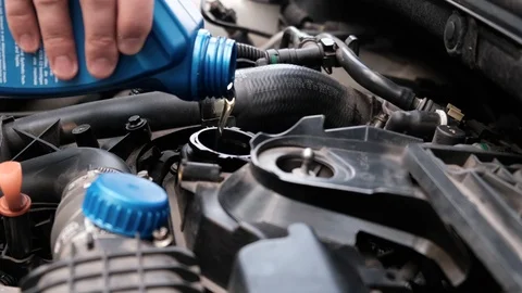 Topping up or replacing engine oil Stock Footage 107086642