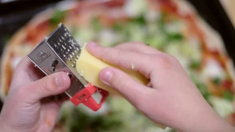 Topping of rolled dough for pizza with tomatoes, green leaves and cheese Stock Footage 76397012