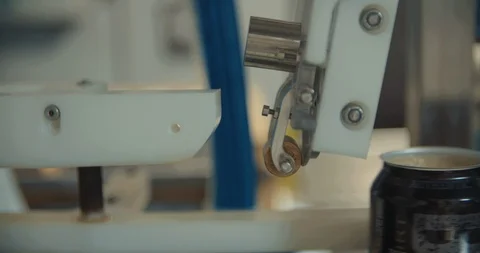 Tops Being put On Cans By Machine In Slow Motion 스톡 동영상 105336912