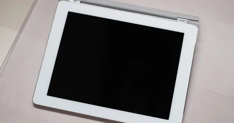 Topshot of electronical Tablet on a table, perfect to use as template Video stock 104595475