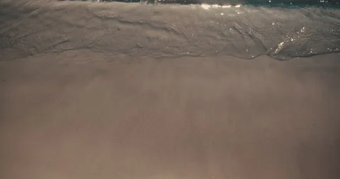 Topshot small waves sand breaking beach slowmo 4k Stock-Footage 153501075