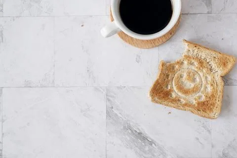 Topview flat lay of working table with coffee and toast bread. Stock Photos