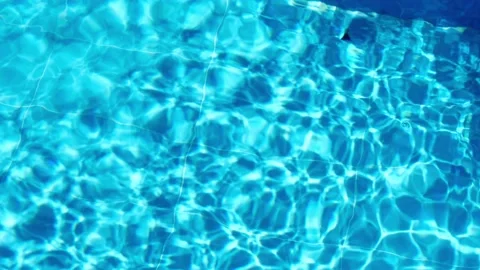 Topview over the surface of the swimming pool. Water shining in swimming pool on Stock Footage 167249541