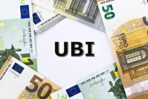 Topview photo on Universal Basic Income theme. The abbreviation UBI on paper Foto stock