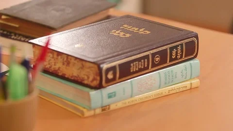 Torahs on table Stock Footage 77045128