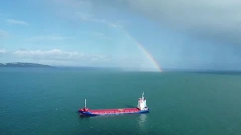Torbay, South Devon, England: Drone View: A coastal ship and rainbow in b/g Stock Footage 222178959