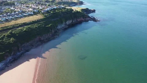Torbay, South Devon, England: Drone View: Broadsands beach &amp; Armchair Cove Stock Footage 223853561