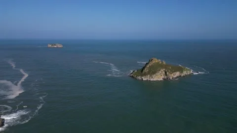 Torbay, South Devon, England: DRONE VIEWS: Thatcher Rock and Orestone Rock Stock Footage 242800211