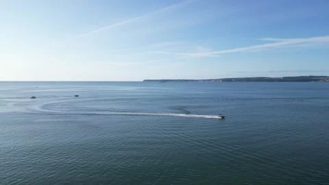 Torbay, South Devon, England: DRONE VIEWS: A Speedboat and Waterskier Stock Footage 247490462