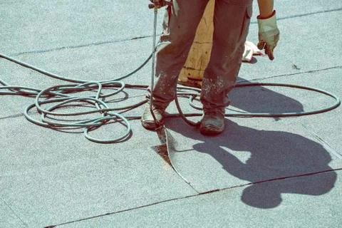 Torch applying bituminous sheet Stock Photos