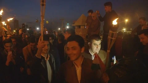 Torch carrying procession - Kurdish Newroz celebration Stock Footage 82406366