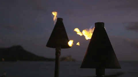 Torch fire flames burning in Hawaii sunset sky Stock Footage 55820870