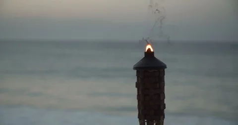 Torch Flame on Beach at Sunset, Cinematic 4K Tiki Waves in Slow Motion Stock Footage 112428869