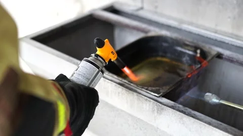 Torch Igniting Flammable Liquid in Fire Experiment Stock Footage 301183288