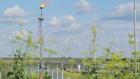 Torch at the modern facility with pipe or process area at the oil depot or tank Stock Footage 199487762