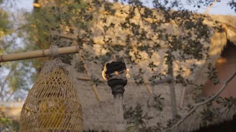 Torch slow motion thatched Polynesian hut background Stock Footage 241294501