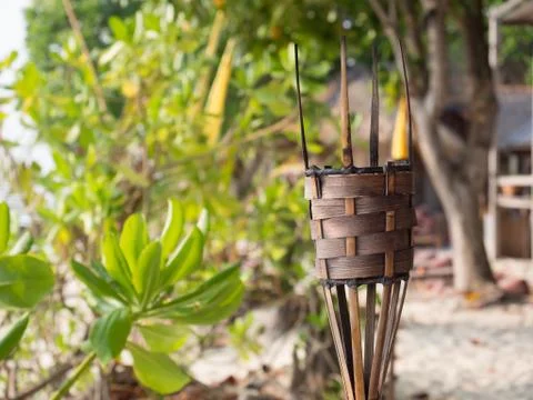 Torch without flame on the beach with blurry background, selective focus Stock Photos