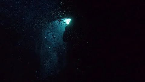 Torches, bubbles and big blue in Comino Caves - Scuba diving  Malta, Comino Stock Footage 314946979