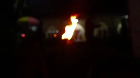Torches light up at night 스톡 동영상 282259889