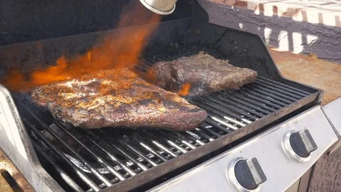 Torching BBQ Beef Brisket With a Propane Torch Stock Footage 104163552