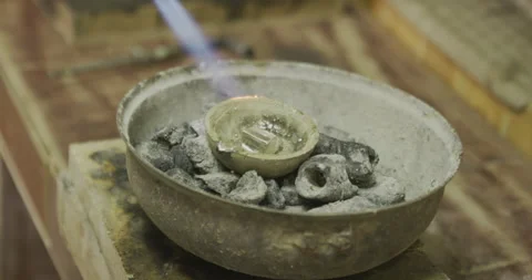 Torching pot with silver inside Stock Footage 141369197
