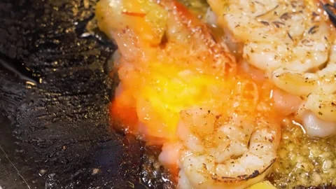 Torching Shrimp and Pineapple on a Flat Top Grill Stock Footage 337440672