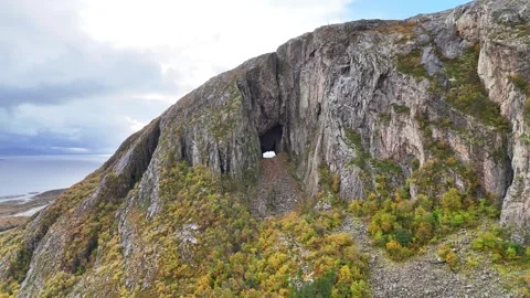 Torghatten: Mountain with the mysterious hole fly in Drone 4K Stock Footage 287207225