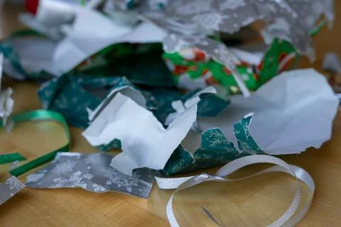 Torn and empty Christmas packaging with packing tape on the floor of the room Foto stock