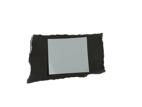 Torn black paper with blank white rectangle on black background Illustrazione stock