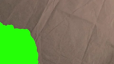 Torn off bottom left corner of a recycled paper. Green screen. Stock Footage 210155314