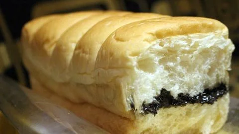 Torn bread filled with chocolate and cheese Stock Photos