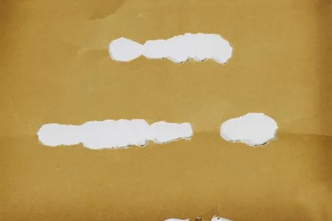 Torn Brown Kraft Paper With Multiple Ripped Holes And White Background Showing T Stock Photos