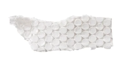 Torn bubble wrap strip with circular cells isolated on white. Wrinkled plasti Stock Photos