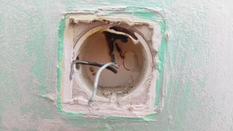 The torn up burnt out socket of an old power socket Stock-Footage 291875829