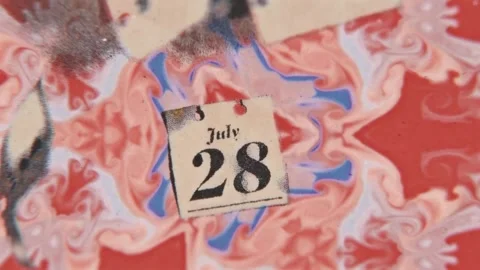 Torn calendar page drifting in a mirrored marbled pattern Stock Footage 346778388