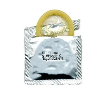 Torn condom pack Stock Photos